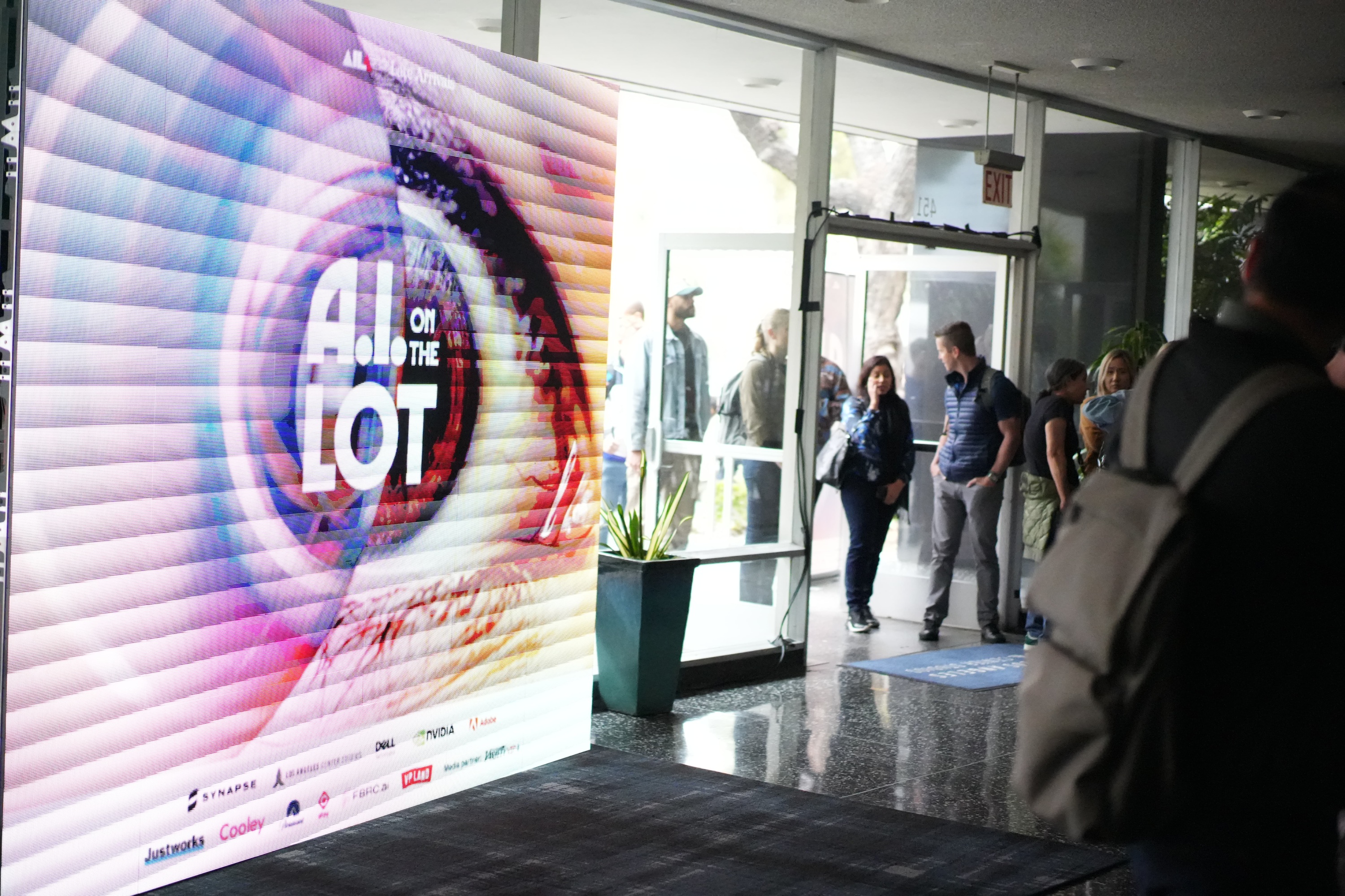 Conference lobby entrance at AI on the Lot 2024 with attendees arriving
